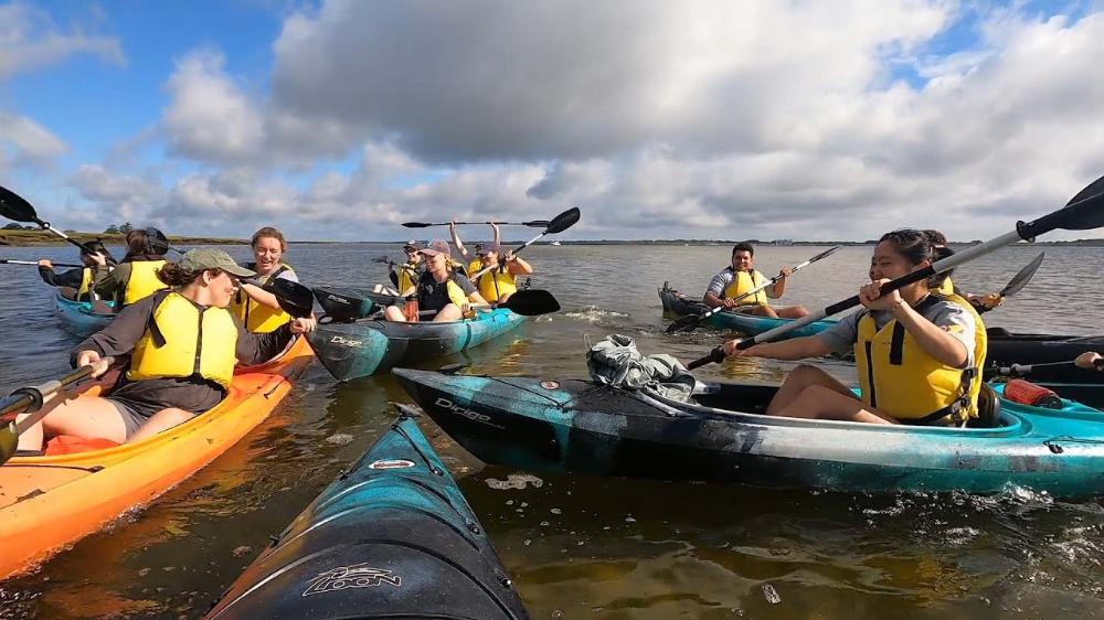 students in kayaks